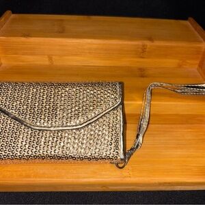 Chic Metallic-looking Clutch with Wristlet from Avon.